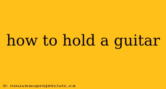 how to hold a guitar